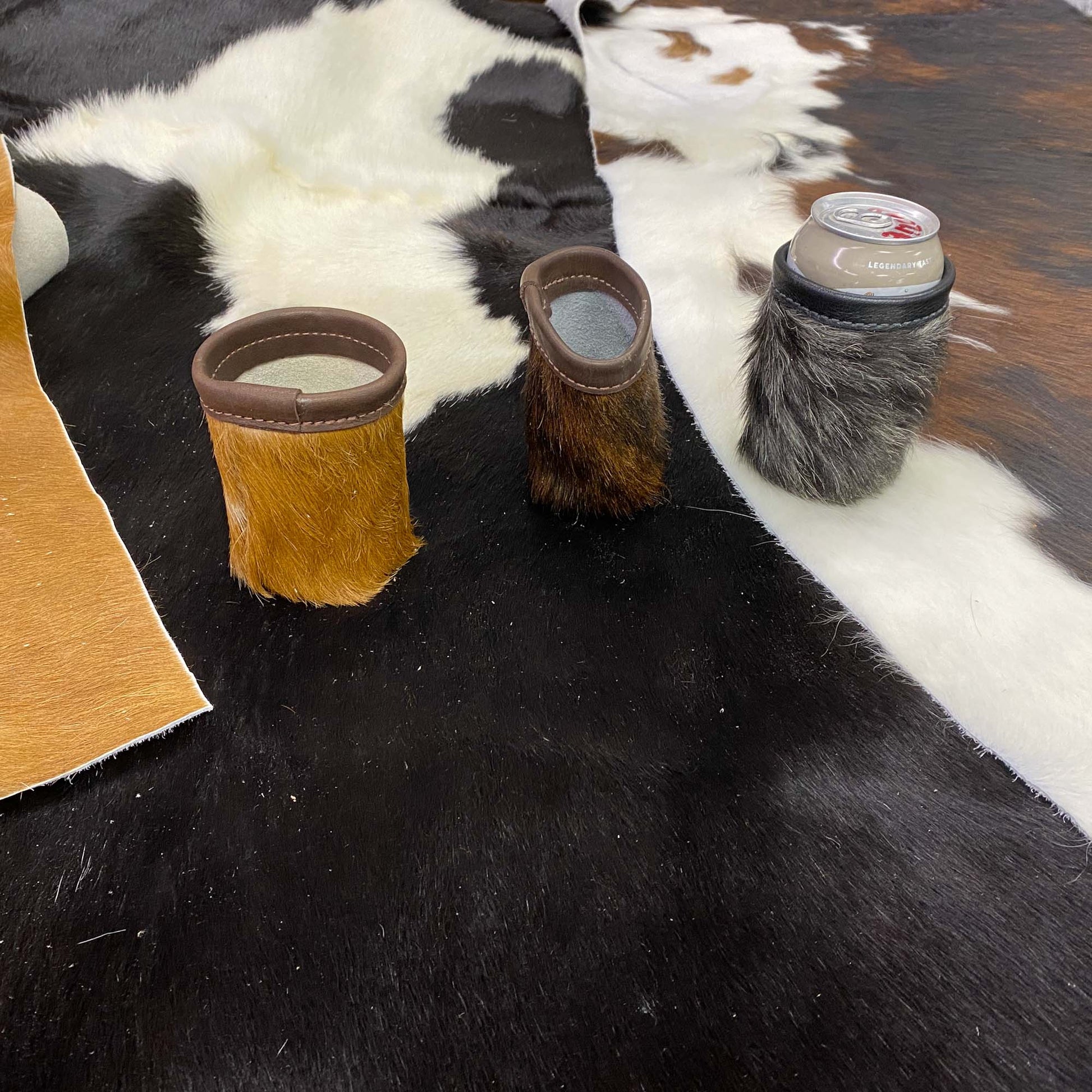 several "moozies" on a cowhide