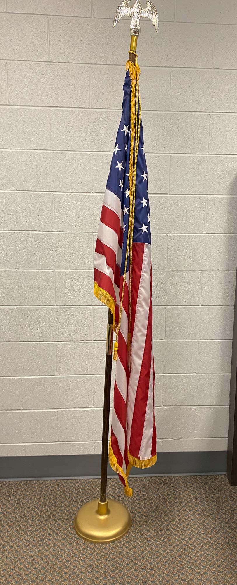 image of indoor american flag on a flagpole